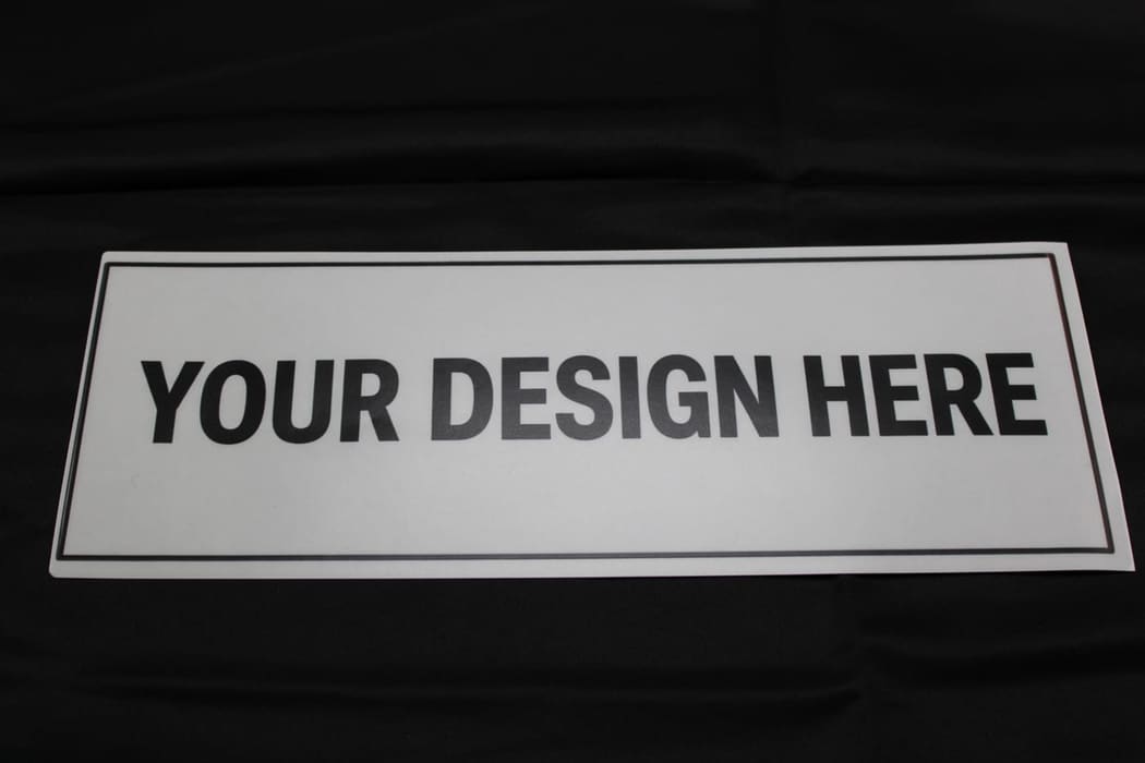 Voorbeeldfoto van een bumpersticker, 28x10 cm